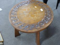 Thomas Whittaker Gnomeman, Yorkshire oak coffee table of circular form, carved with a sinuous floral