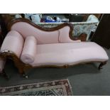 Victorian mahogany framed chaise longue with shaped back and carved Showood frame, raised on short