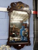 19th century mahogany wall mirror, the fretwork frame decorated with a gilt ho-ho bird, 93cm high
