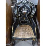 Victorian black lacquer and mother of pearl inlaid side chair, with cane seat, raised on cabriole