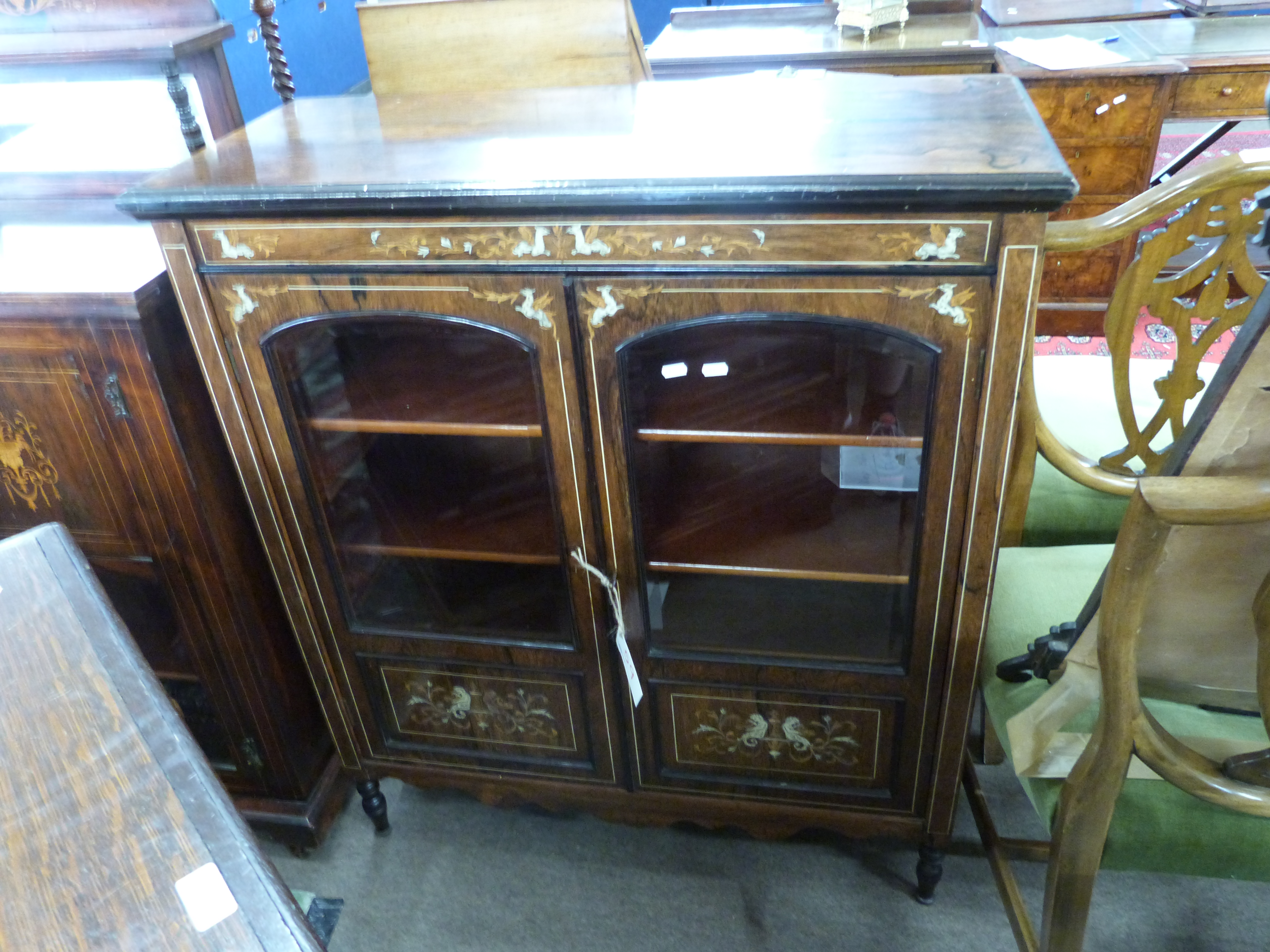 Late 19th century rosewood side cabinet decorated with inlaid detail fitted with two glazed and