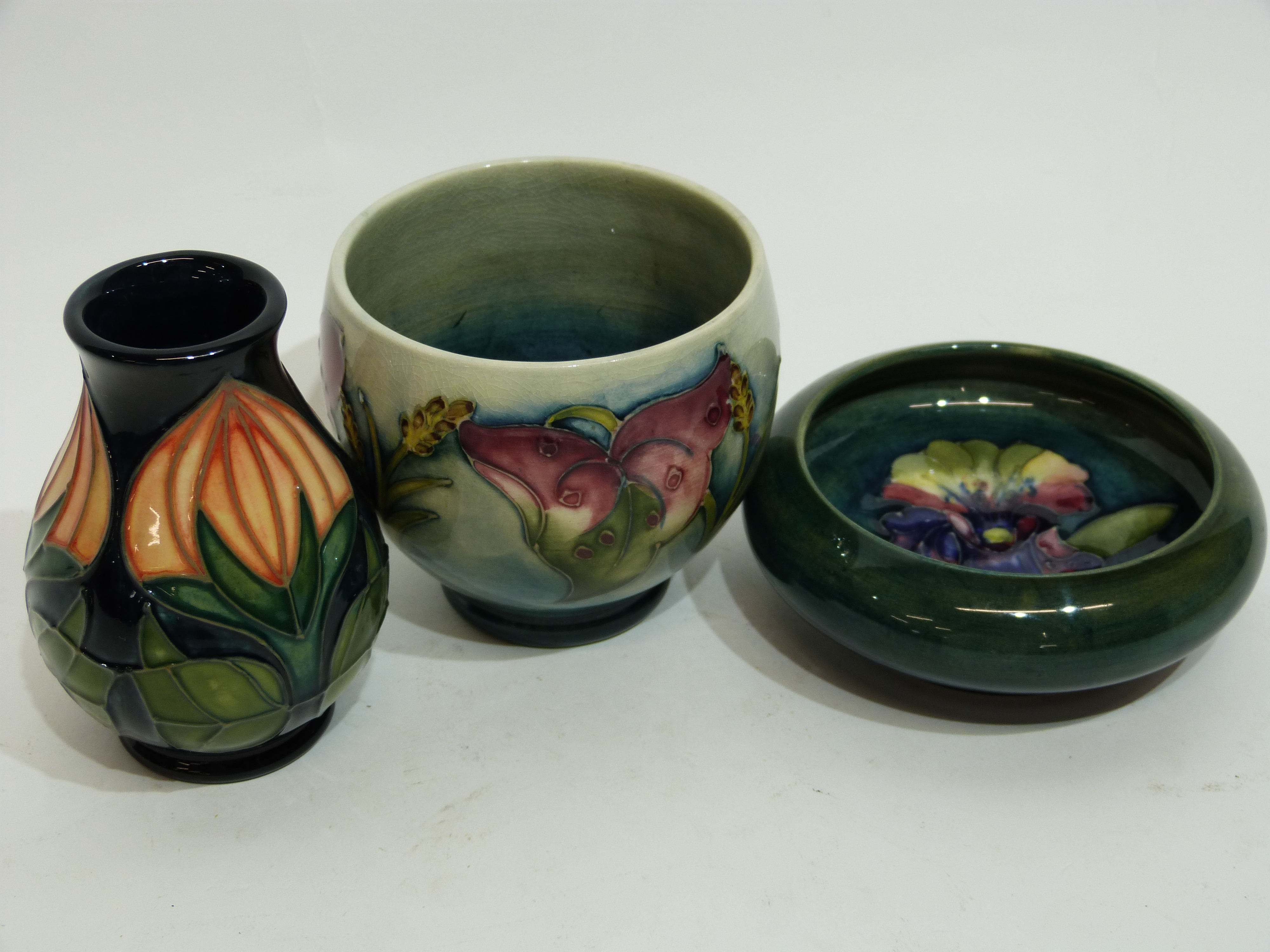 Small modern Moorcroft vase with tube lined design, a further Moorcroft bowl with design of