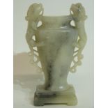 Chinese soapstone vase of flattened shape, flanked by two Chinese dragons, on rectangular base, with