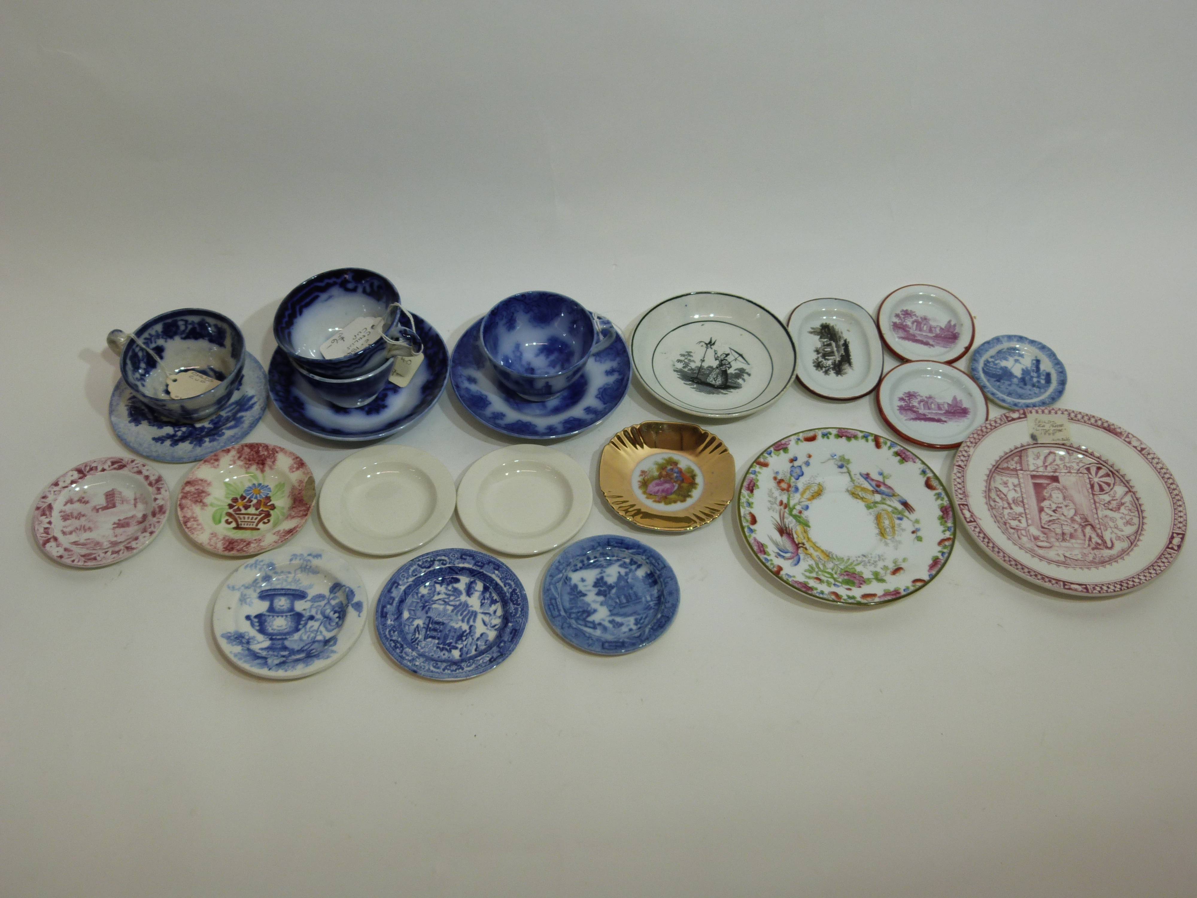 Miniature Victorian pottery tea wares including a rare saucer with a bird in a ring design after