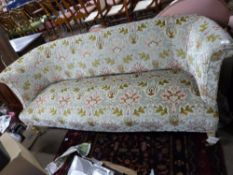 Early 20th century three-seater floral upholstered sofa raised on short turned wooden legs with