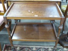 Early 20th century tea trolley with turned legs, length approx 76cm