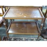 Early 20th century tea trolley with turned legs, length approx 76cm