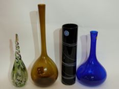 Four Art glass wares, one bearing a label for Studio Glass Sweden, and a blue glass baluster vase