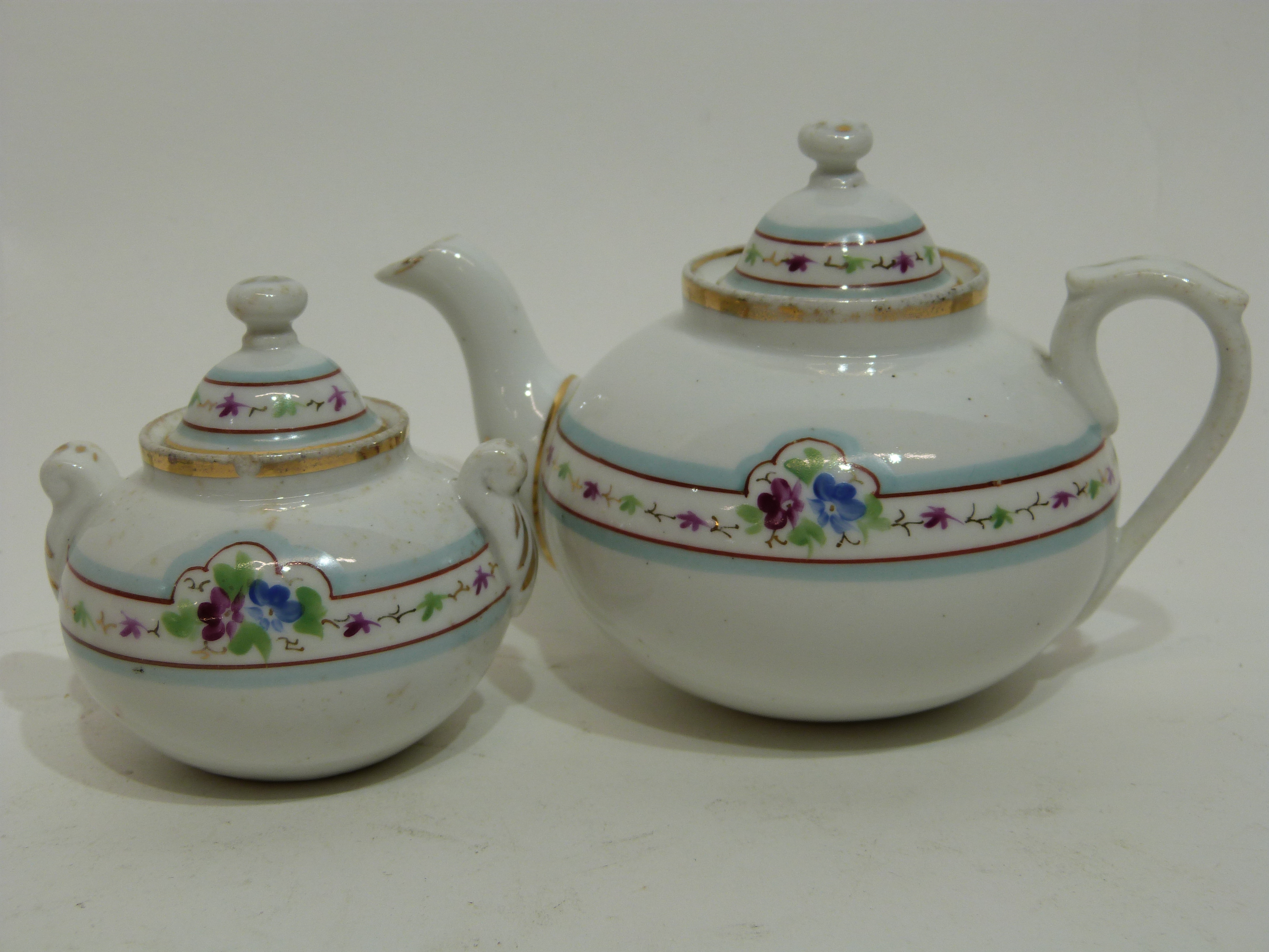 Miniature 19th century child's tea set comprising tea pot, sugar bowl and three cups and saucers - Image 4 of 4