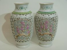 Modern pair of Oriental vases with a pierced design and pink flowers (2), 20cm high