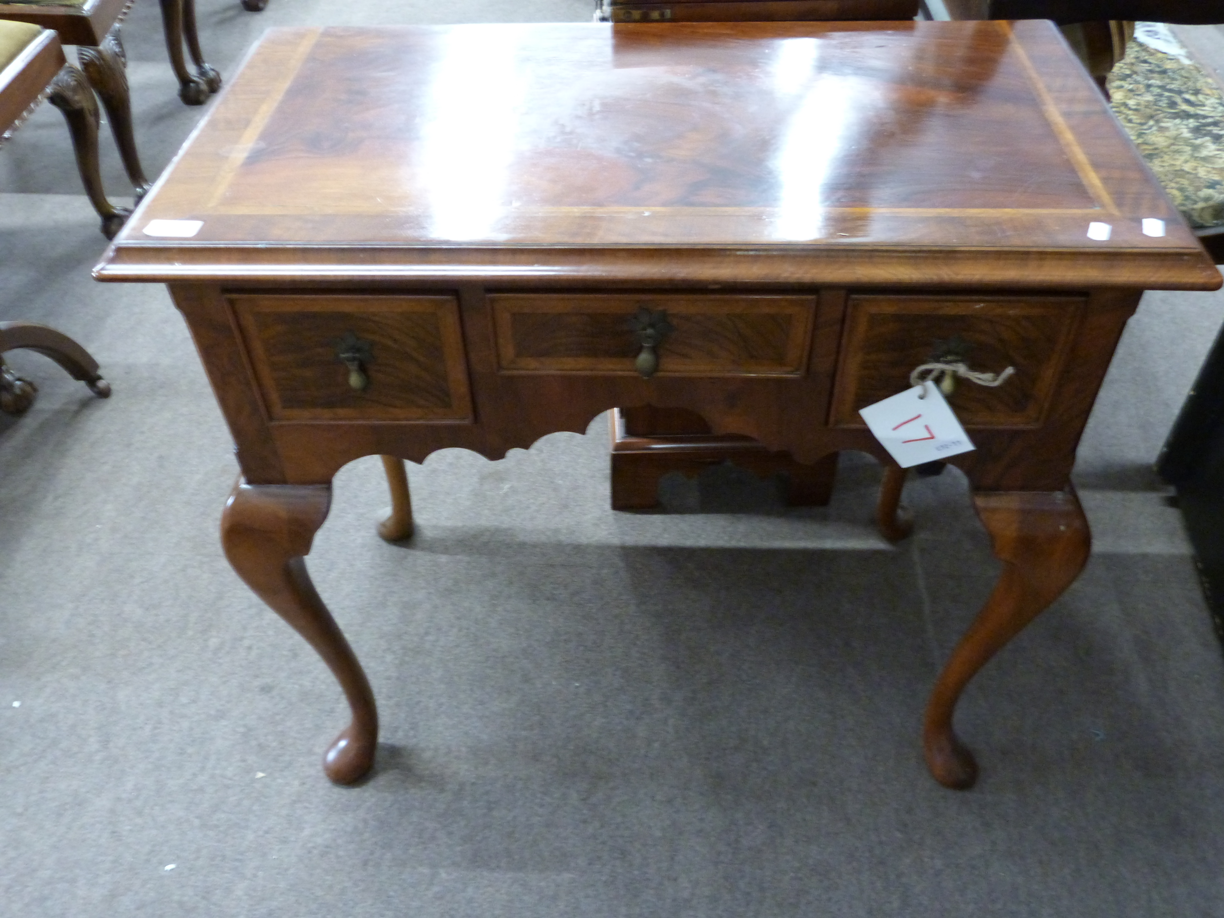 Good quality reproduction walnut veneered lowboy in the Queen Anne style, the body with three