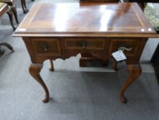 Good quality reproduction walnut veneered lowboy in the Queen Anne style, the body with three