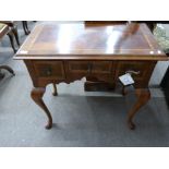 Good quality reproduction walnut veneered lowboy in the Queen Anne style, the body with three