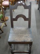 17th century oak hard seated chair, the joined oak frame with turned front legs and shaped back,