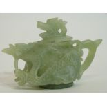 Green soapstone Chinese tea pot, modelled in relief with dragons and dragon finial, 9cm high