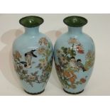 Pair of Japanese cloisonne vases, Meiji period, the light blue ground decorated with foliage and