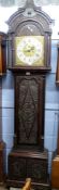 Ornately carved longcase clock, with gilt dial mounted with Roman chapter ring, subsidiary minutes