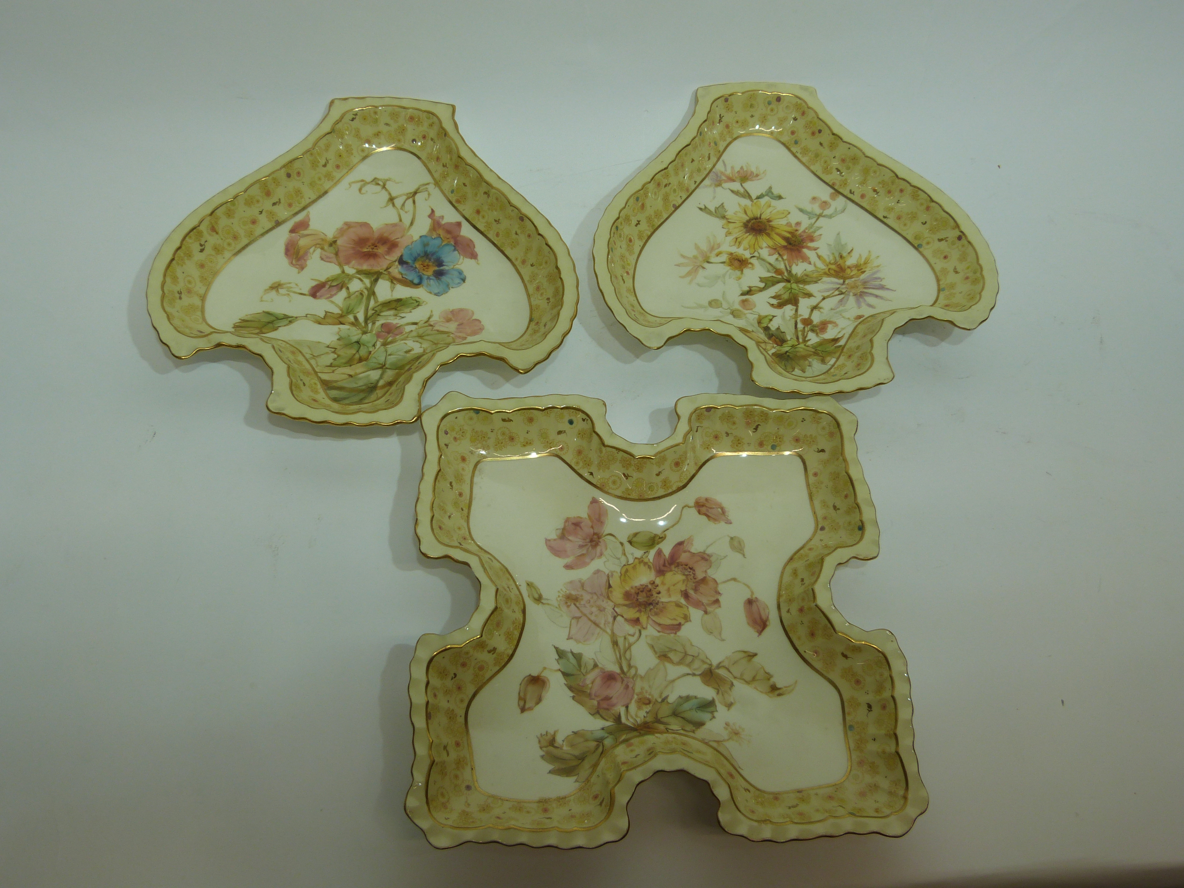 Group of three Royal Crown Derby dishes in the Harrow pattern, all with shaped borders with floral