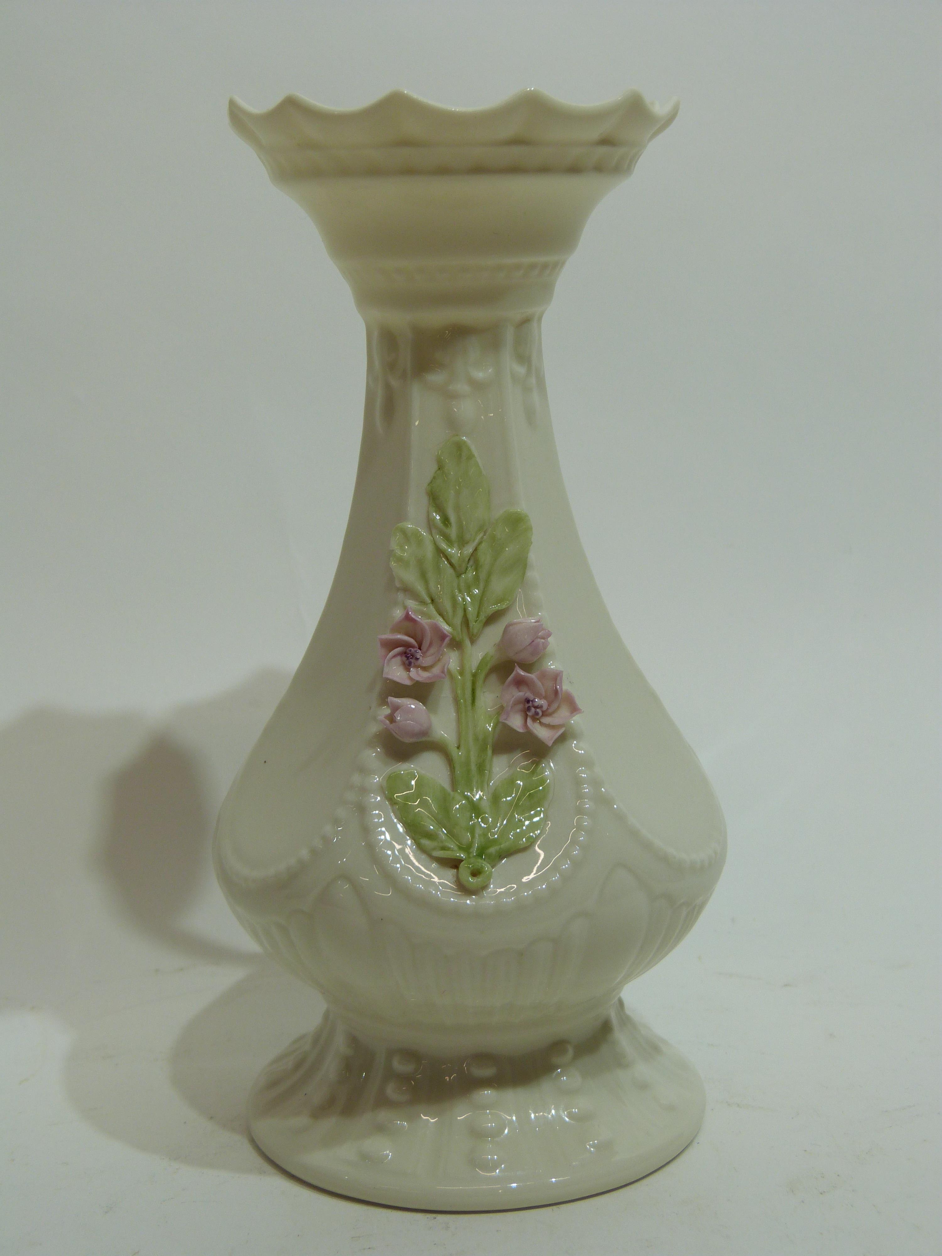 Belleek vase with a floral design of leaves and flowers in relief