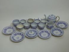 Victorian miniature tea set with blue floral decoration including tea cups and saucers