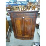 19th century mahogany corner cabinet of large proportions, the bow front body with two panelled