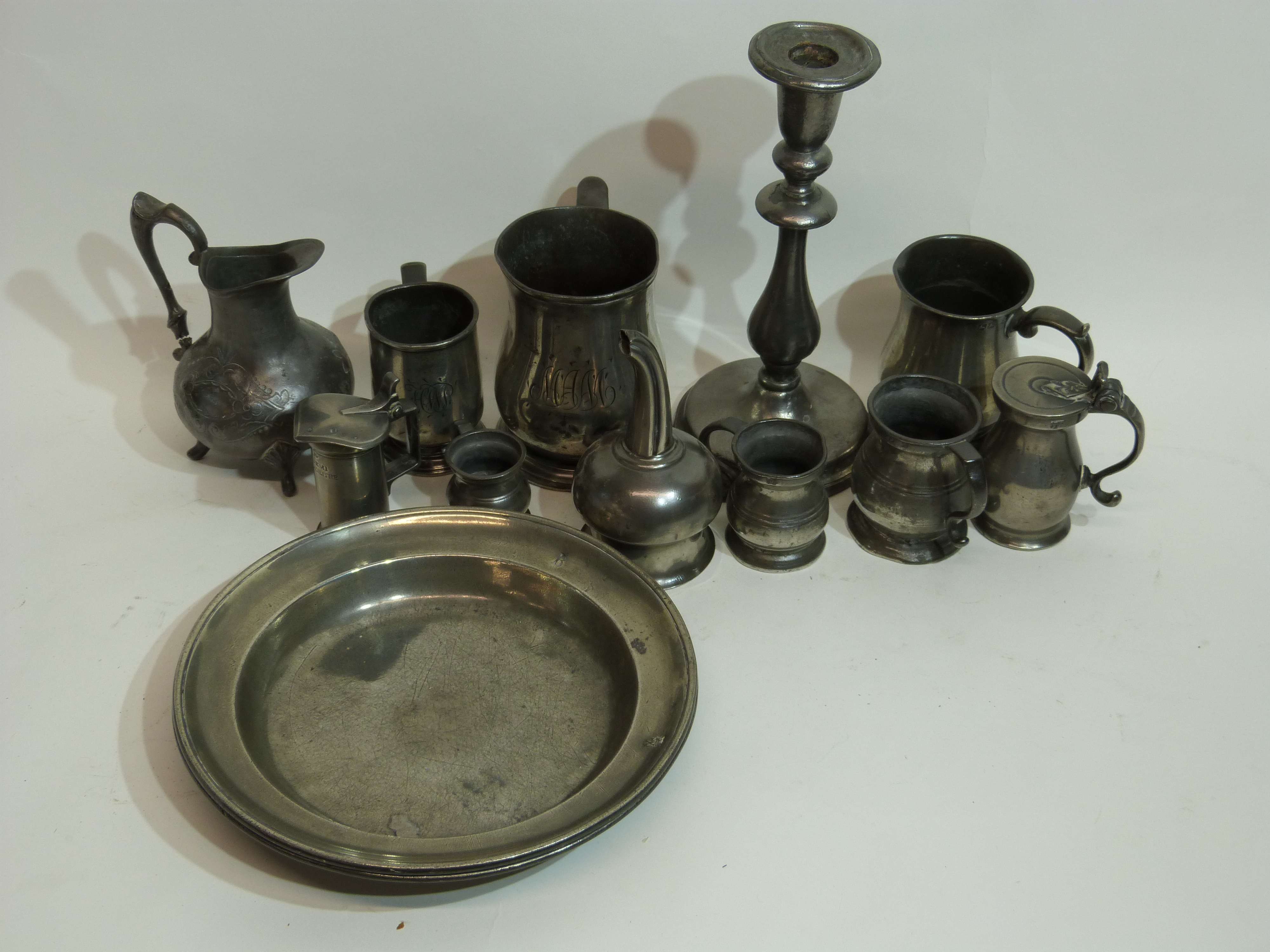 Quantity of pewter, some 18th century items, including small pewter tankard with scroll handle and