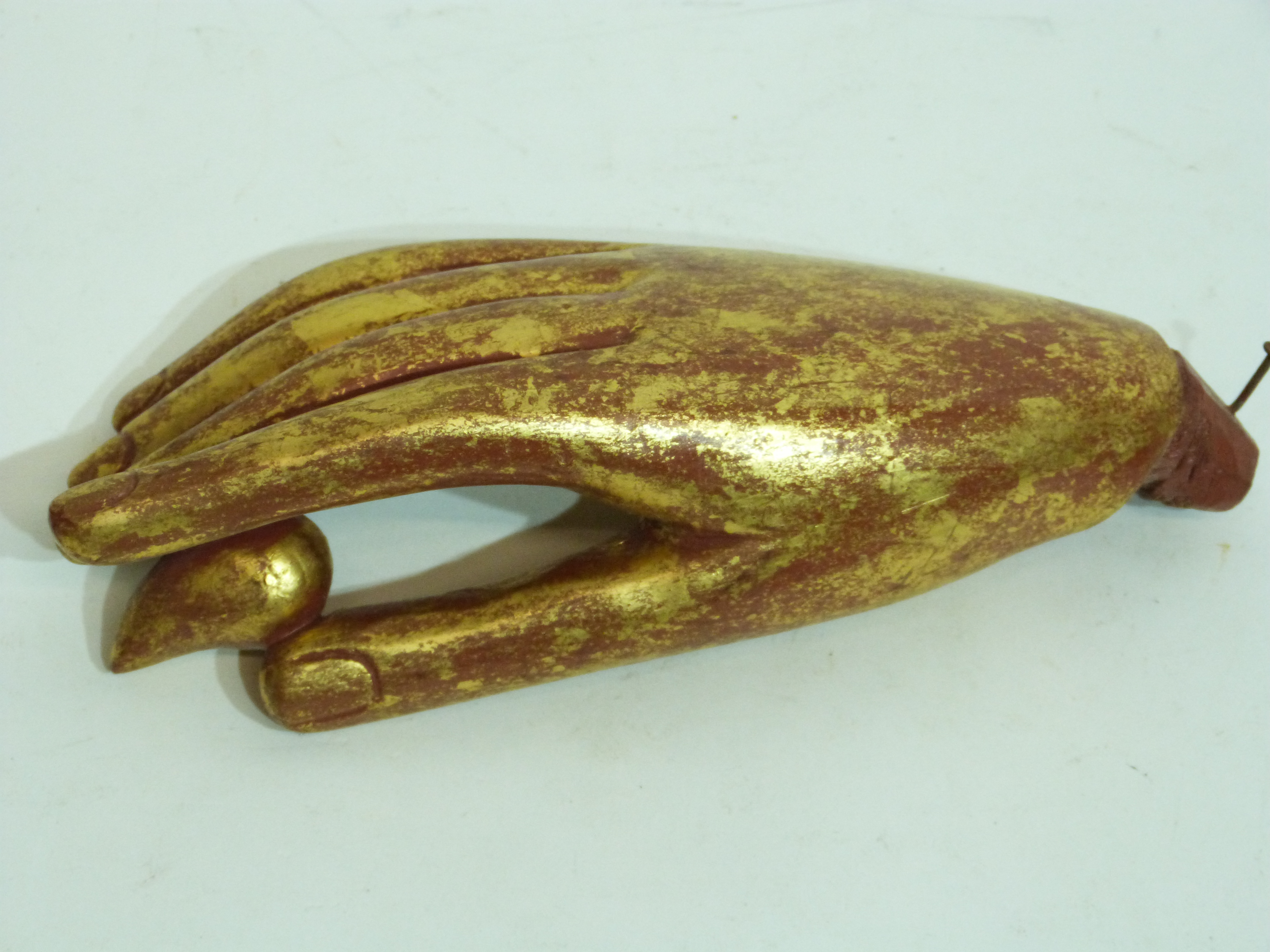 Oriental wooden study of a hand with red and gilt highlights, possibly from a religious figure - Image 2 of 2