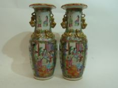 Pair of 19th century Cantonese vases decorated in famille rose style, with panels of figures and