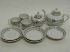 Miniature 19th century child's tea set comprising tea pot, sugar bowl and three cups and saucers