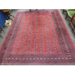 Large 20th century Bokhara type carpet with a large central panel decorated with medallions,