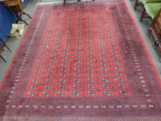 Large 20th century Bokhara type carpet with a large central panel decorated with medallions,