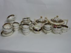 19th century English porcelain tea set, possibly Derby, decorated to the interior with a blue border