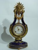 French mantel clock, the blue ground with gilt decoration in Sevres style, 40cm high