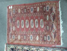 Caucasian prayer rug, red ground with blue medallions, 3 x 2ft