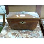 19th century mahogany and inlaid sarcophagus formed tea caddy, the hinged lid opening to a fitted