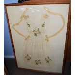 Framed 19th century maid's apron, the silk embroidered with flowers, in wooden frame