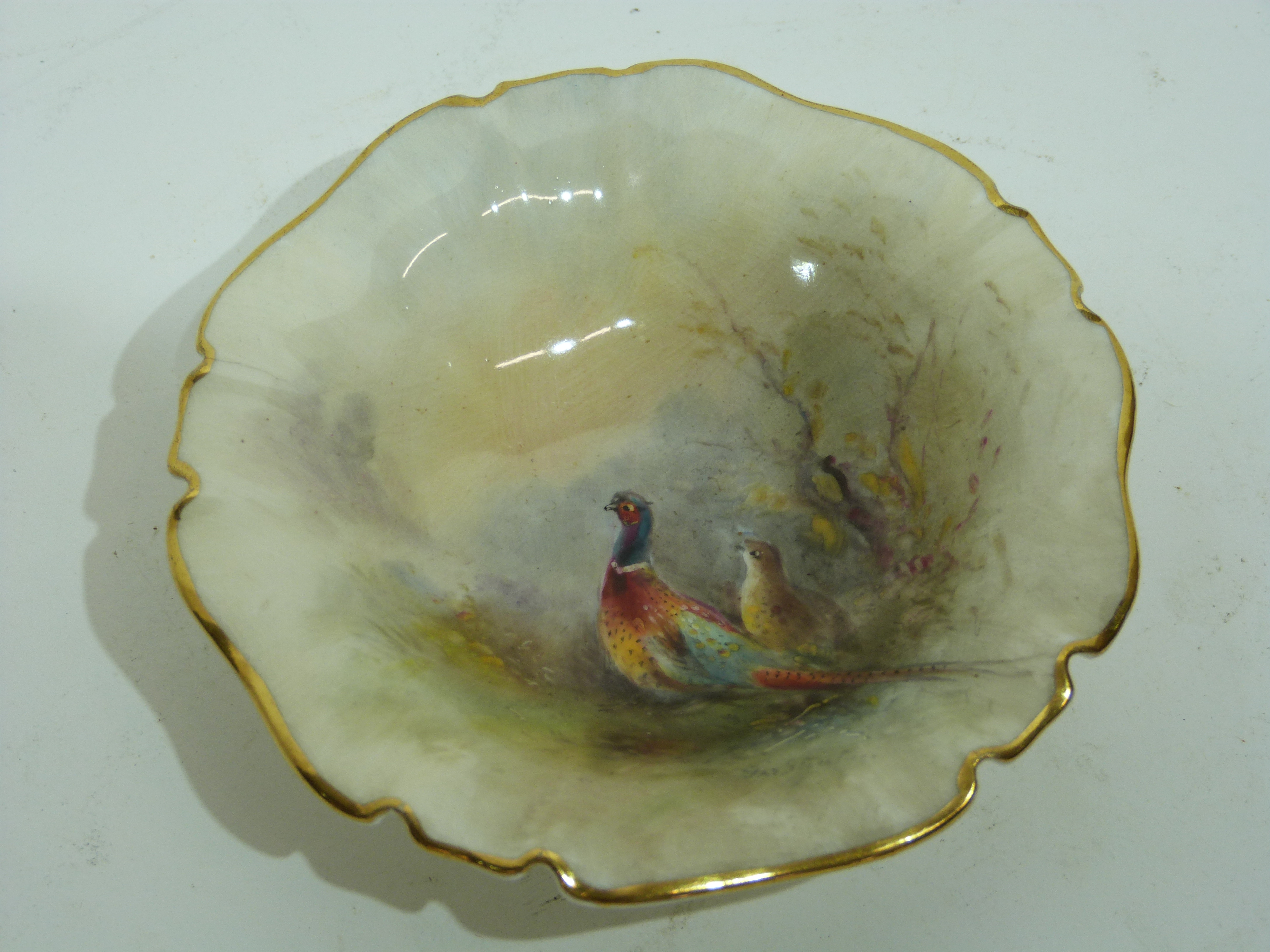 Small Royal Worcester pin dish decorated with pheasants by James Stinton, 9cm diam, Worcester puce