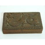 Chinese wooden hinged box, the top carved with a dragon in relief, 20cm wide