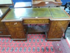 Victorian walnut veneered twin pedestal desk, the top inset with green tooled leather, the base with