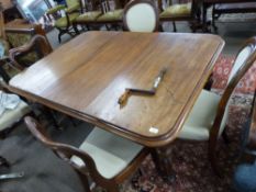 Victorian rectangular mahogany extending dining table raised on fluted legs with casters, together