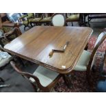 Victorian rectangular mahogany extending dining table raised on fluted legs with casters, together