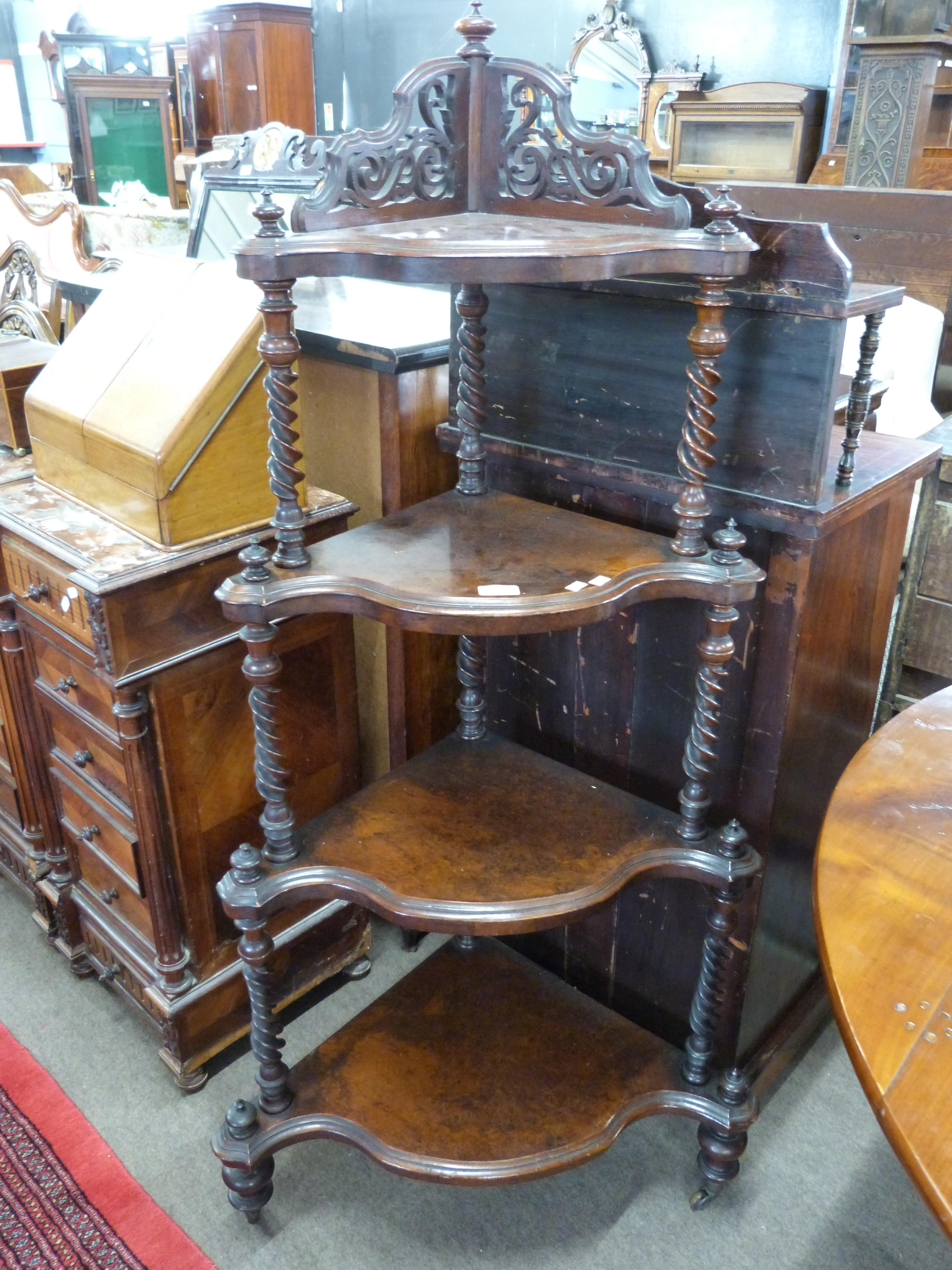 Victorian burr walnut veneered four-tier whatnot with turned supports, raised on short feet with