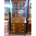 Late Georgian mahogany bureau bookcase, the top section with concave sided cornice above two glass