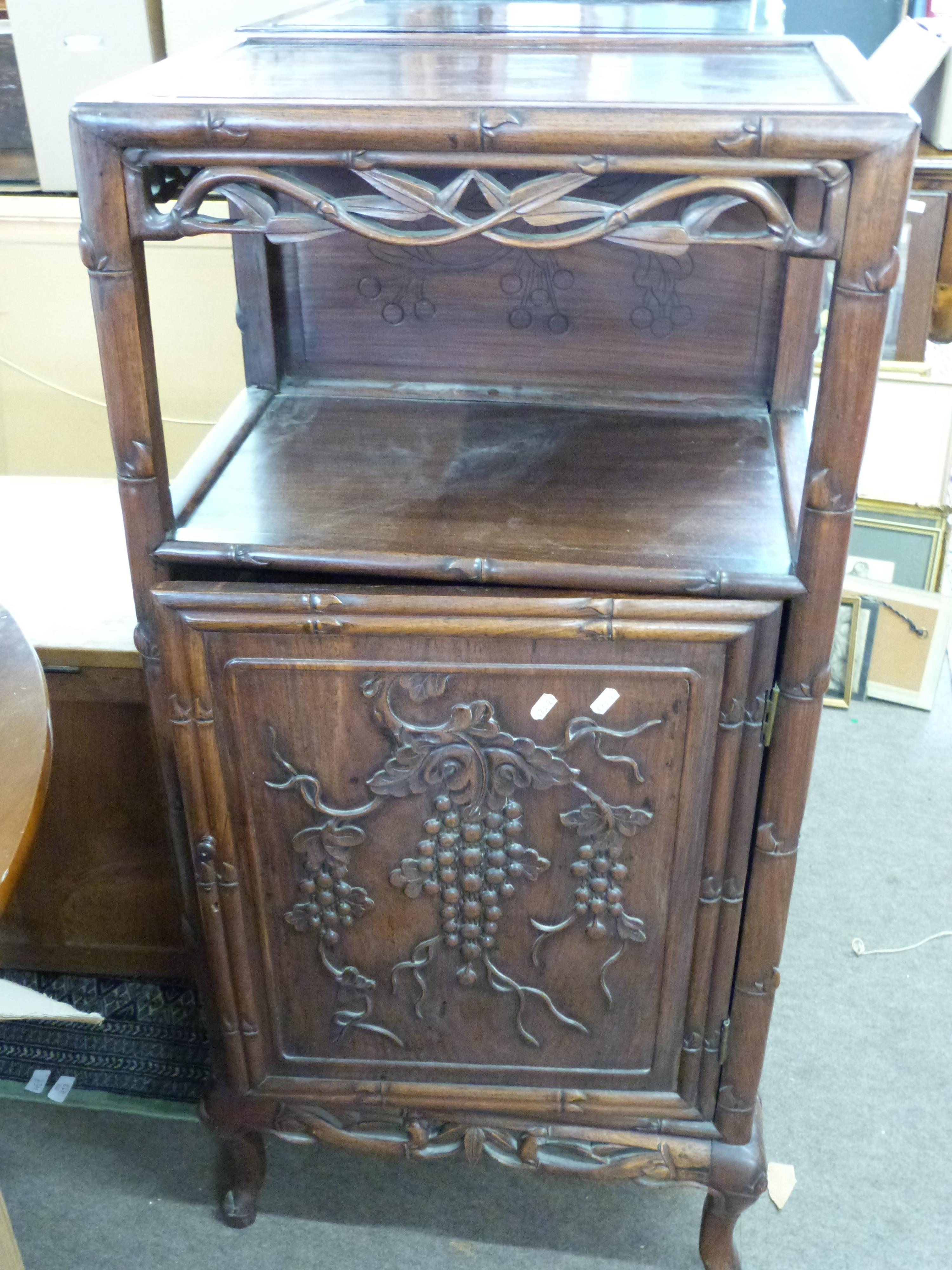 Chinese rosewood music or side cabinet, the top with floral fretwork surround over a recess and a
