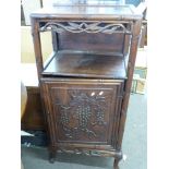 Chinese rosewood music or side cabinet, the top with floral fretwork surround over a recess and a