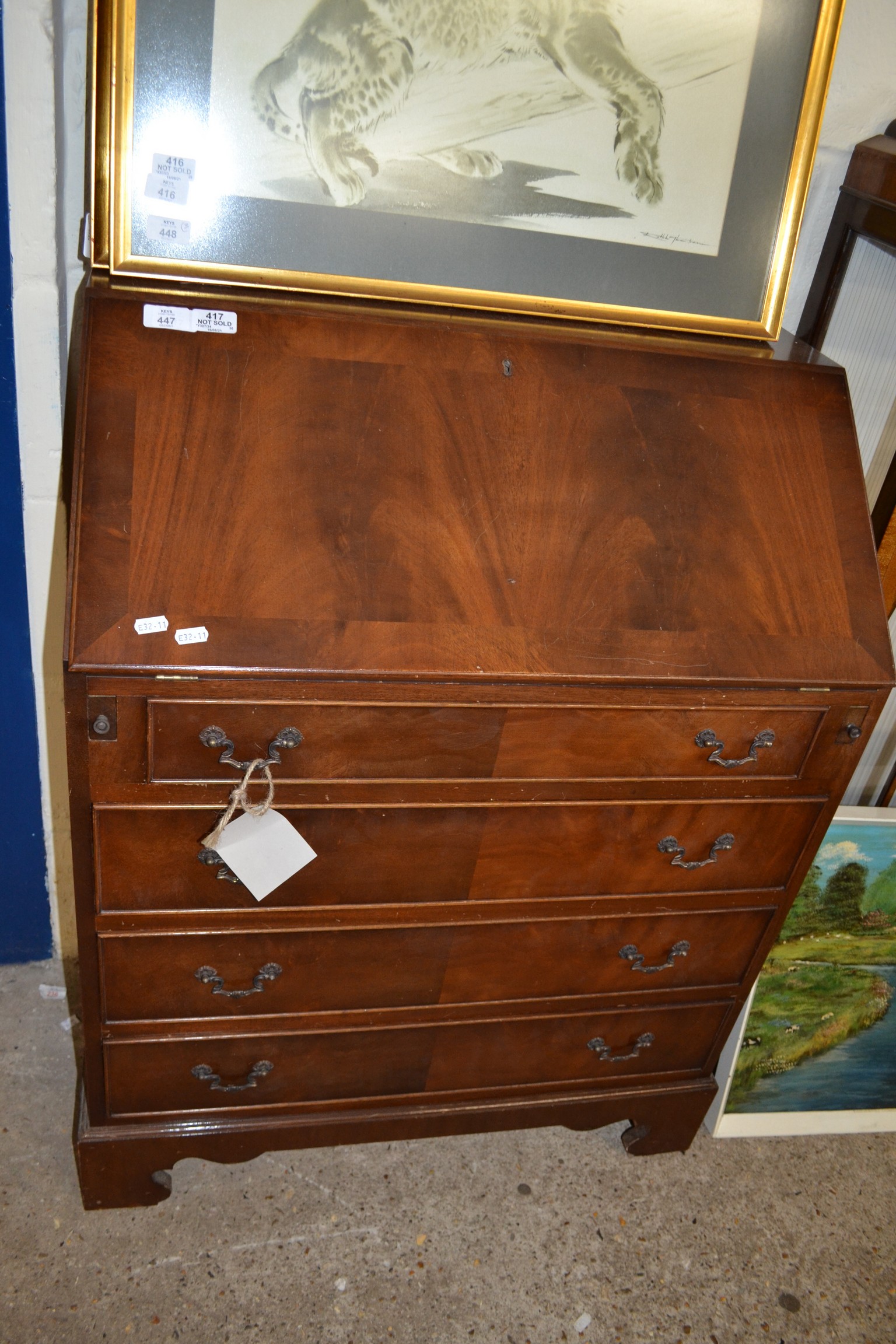 REPRODUCTION MAHOGANY BUREAU WITH FALL FRONT, FITTED INTERIOR OVER FOUR DRAWERS RAISED ON BRACKET