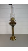 LATE 19TH/EARLY 20TH CENTURY BRASS OIL LAMP ON FLUTED COLUMN BASE