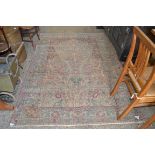 20TH CENTURY WOOL FLOOR RUG DECORATED WITH A TREE OF LIFE DESIGN, 209CM LONG