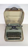 VINTAGE OLYMPIA PORTABLE TYPEWRITER IN CASE