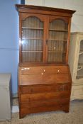 EARLY 20TH CENTURY OAK BUREAU BOOKCASE CABINET, THE TOP SECTION WITH TWO GLAZED DOORS OVER A BASE